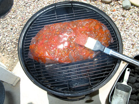 On the smoker, brushing on the mop