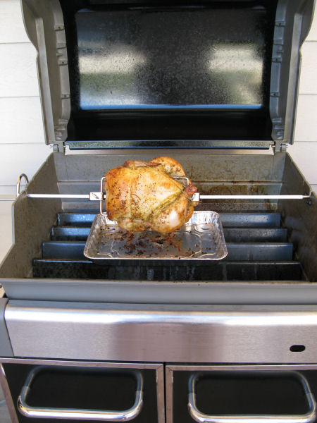 You'll need to remove the grill racks to make room for the chicken to rotate on the spit